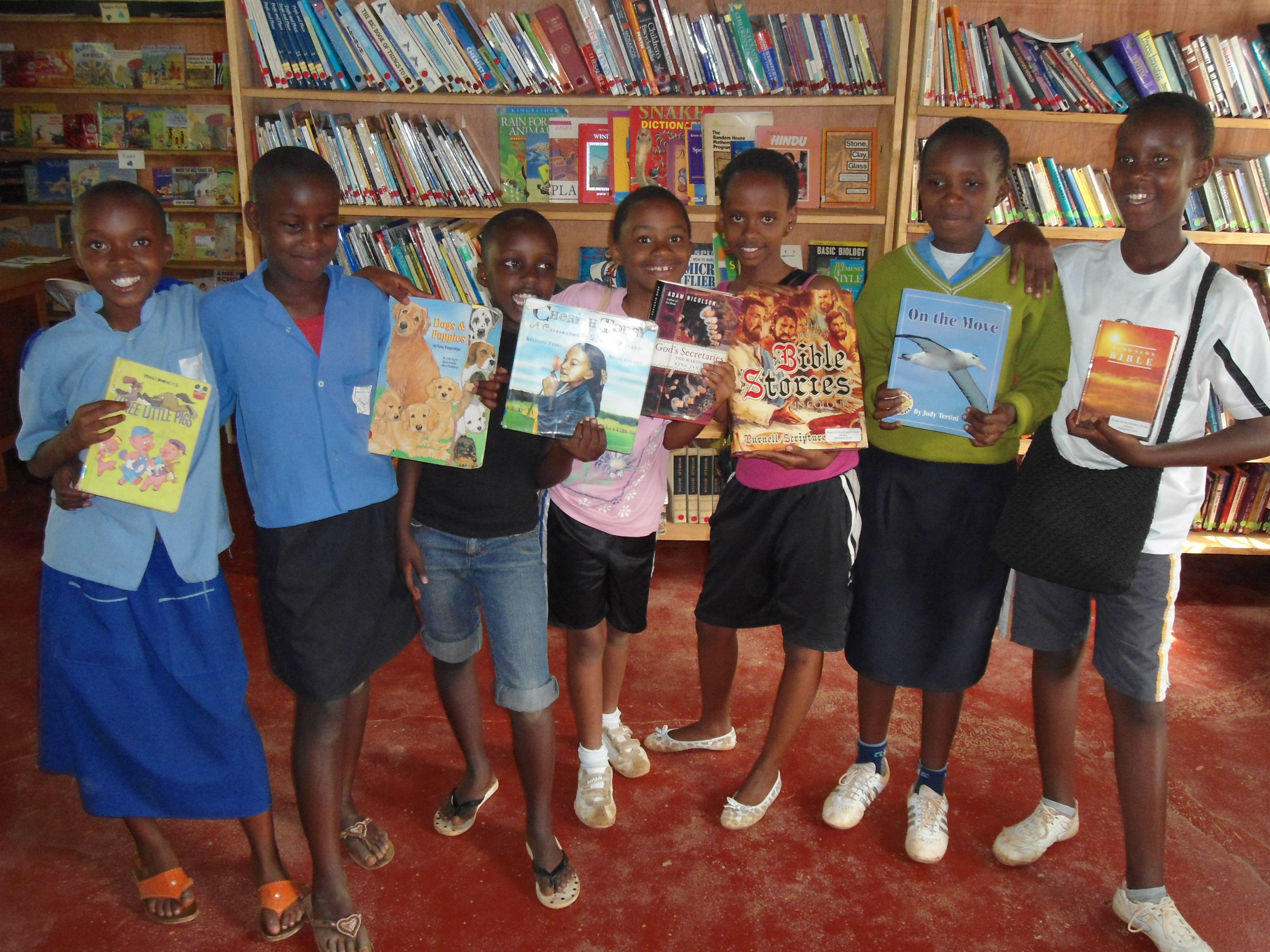 Students with books in the Library